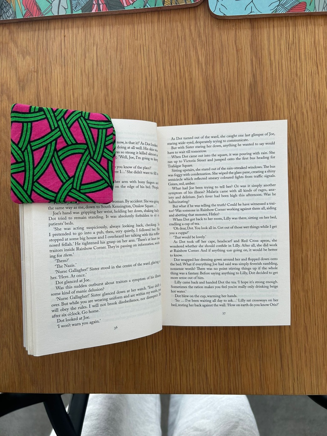 A handcrafted corner bookmark on the pages of an open book