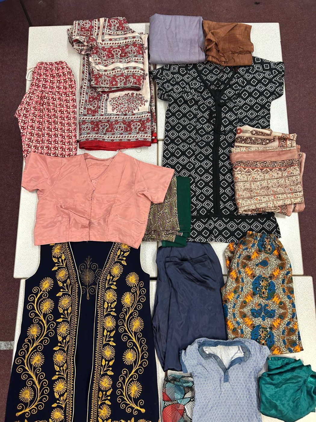 Donated cultural clothing from various communities — the starting point of every product we make