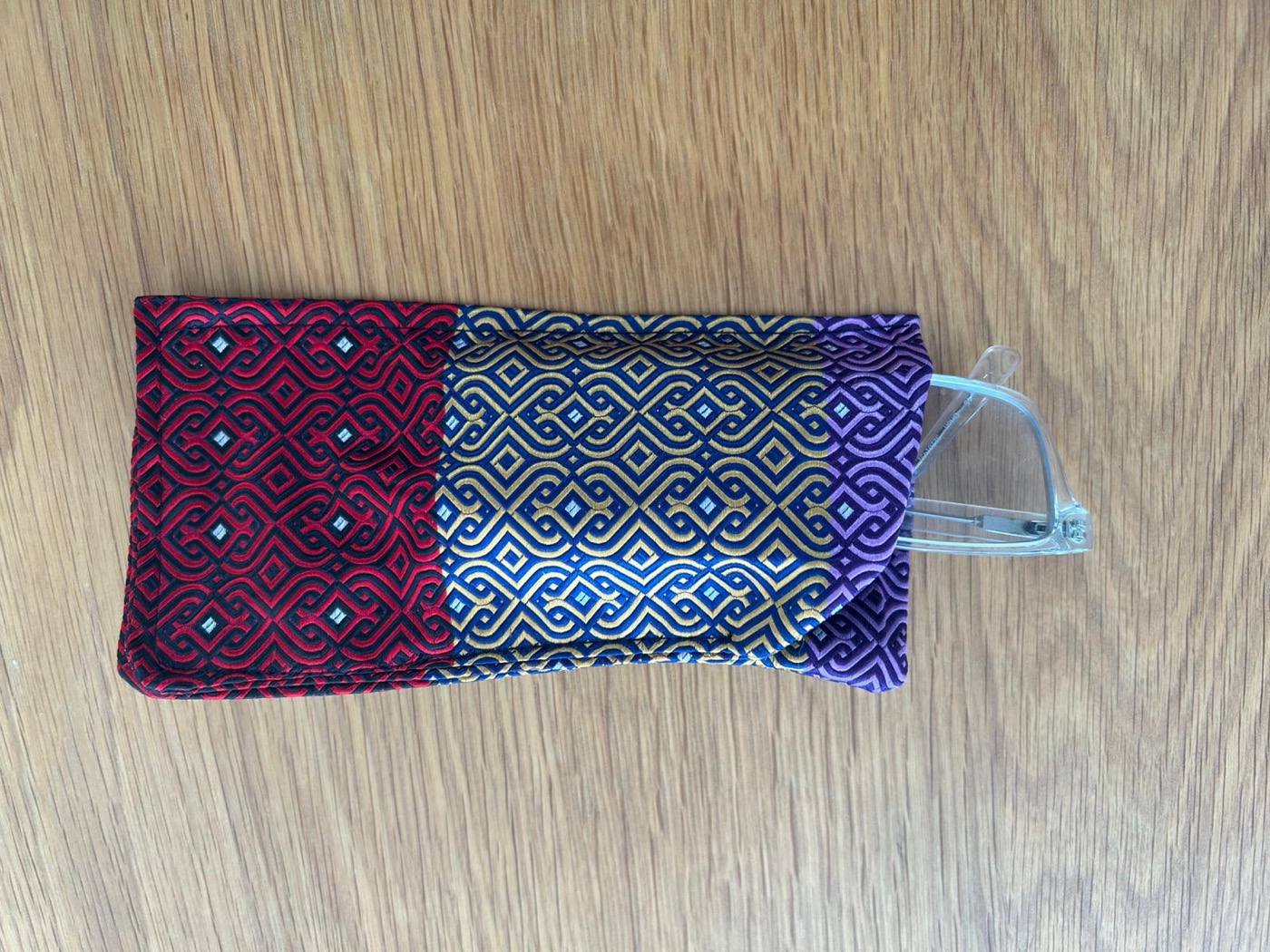 Glasses case with glasses resting on top