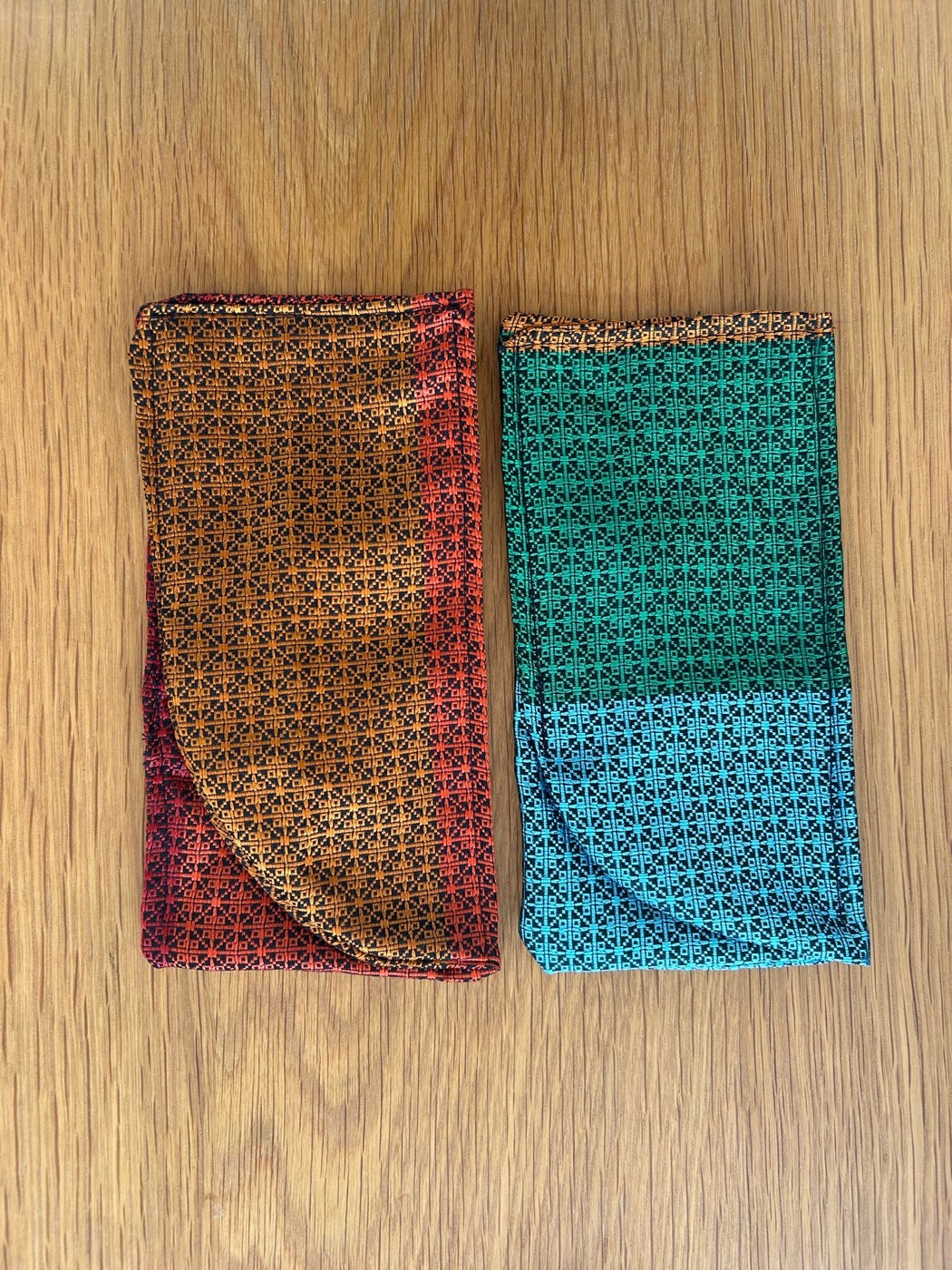 Two glasses cases side by side in contrasting fabrics